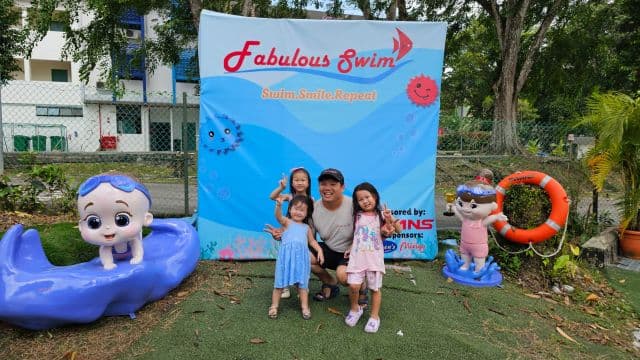 Coach and student posing poolside